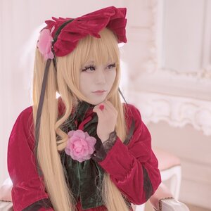 Rating: Safe Score: 0 Tags: 1girl bangs blonde_hair blue_eyes blurry bow flower lips long_hair long_sleeves nose realistic rose shinku sitting solo User: admin