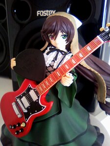 Rating: Safe Score: 0 Tags: 1girl bass_guitar brown_hair doll dress electric_guitar frills green_eyes guitar heterochromia instrument long_hair long_sleeves looking_at_viewer plectrum red_eyes solo suiseiseki User: admin