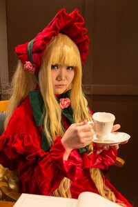 Rating: Safe Score: 0 Tags: 1girl bangs blonde_hair blue_eyes bonnet cup dress flower frills lips long_hair long_sleeves looking_at_viewer realistic red_dress rose saucer shinku sitting solo teacup User: admin