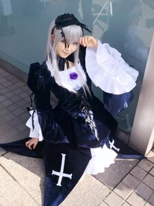 Rating: Safe Score: 0 Tags: 1girl black_dress dress flower frilled_sleeves frills hairband long_hair long_sleeves looking_at_viewer purple_rose rose silver_hair solo standing suigintou User: admin