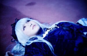 Rating: Safe Score: 0 Tags: 1girl blurry closed_mouth depth_of_field dress expressionless frills hairband lips long_hair lying purple_eyes ribbon solo suigintou upper_body white_hair User: admin