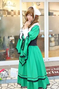Rating: Safe Score: 0 Tags: 1girl blurry brown_hair building dress green_dress green_eyes long_hair long_sleeves looking_at_viewer photo smile solo standing suiseiseki User: admin