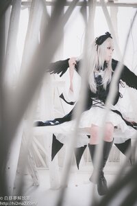 Rating: Safe Score: 0 Tags: 1girl bird bird_on_hand black_feathers black_footwear boots crow dress feathers hair_ornament knee_boots long_hair solo suigintou User: admin