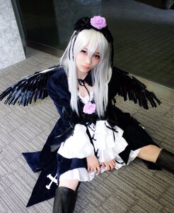 Rating: Safe Score: 0 Tags: 1girl black_legwear black_wings dress feathers flower frills gothic_lolita long_hair long_sleeves looking_at_viewer photo rose sitting solo suigintou thighhighs wings User: admin