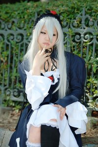 Rating: Safe Score: 0 Tags: 1girl blurry blurry_background depth_of_field dress flower frills hairband hand_to_own_mouth long_hair long_sleeves photo solo suigintou white_hair User: admin