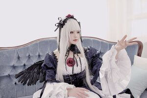 Rating: Safe Score: 0 Tags: 1girl bangs black_wings closed_mouth dress feathered_wings flower frills hairband long_hair long_sleeves looking_at_viewer red_eyes rose sitting solo suigintou wide_sleeves wings User: admin