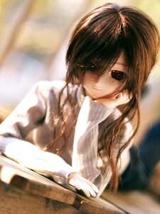 Rating: Safe Score: 0 Tags: 1girl blurry blurry_background blurry_foreground book brown_hair depth_of_field doll hair_over_one_eye long_hair looking_at_viewer open_book red_eyes smile solo suiseiseki sweater turtleneck User: admin