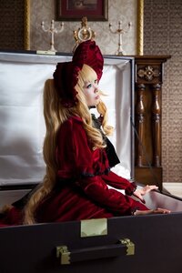 Rating: Safe Score: 0 Tags: 1girl blonde_hair blue_eyes bonnet dress indoors lips long_hair long_sleeves painting_(object) red_dress shinku sitting solo User: admin