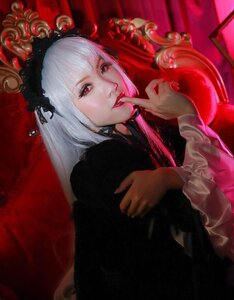 Rating: Safe Score: 0 Tags: 1girl bangs finger_to_mouth gothic_lolita hairband lips long_hair long_sleeves looking_at_viewer nail_polish red_eyes red_lips solo suigintou upper_body white_hair User: admin