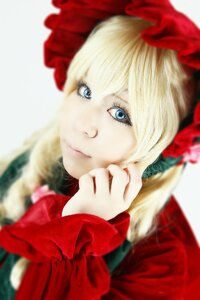 Rating: Safe Score: 0 Tags: 1girl bangs blonde_hair blue_eyes blurry blurry_background blurry_foreground closed_mouth depth_of_field eyelashes flower lips looking_at_viewer red_gloves shinku smile solo upper_body User: admin