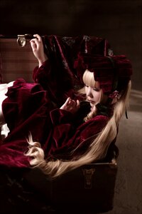 Rating: Safe Score: 0 Tags: 1girl blonde_hair bonnet cup dress long_hair long_sleeves shinku sitting solo User: admin