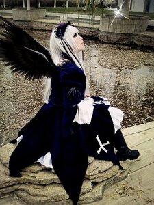 Rating: Safe Score: 0 Tags: 1girl black_dress black_wings dress frills hairband long_hair long_sleeves outdoors silver_hair solo standing suigintou wings User: admin