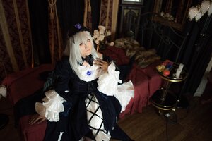 Rating: Safe Score: 0 Tags: 1girl black_dress dress flower frills gothic_lolita hat lolita_fashion long_hair red_eyes rose sitting solo suigintou white_hair User: admin