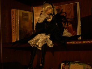 Rating: Safe Score: 0 Tags: 1girl black_dress doll dress frills long_sleeves red_eyes sitting solo suigintou User: admin