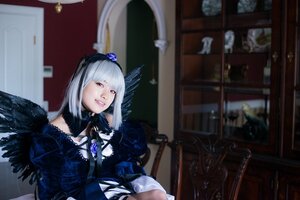 Rating: Safe Score: 0 Tags: 1girl bangs black_feathers black_wings blurry blurry_background depth_of_field dress feathered_wings feathers flower frills gothic_lolita indoors lips looking_at_viewer silver_hair solo suigintou wings User: admin