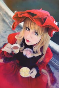 Rating: Safe Score: 0 Tags: 1girl bangs blonde_hair blue_eyes blurry blurry_background blurry_foreground bow cup depth_of_field dress flower food hat lips long_hair looking_at_viewer photo red_dress rose saucer shinku solo tea teacup User: admin