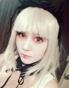 Rating: Safe Score: 0 Tags: 1girl bangs blonde_hair blurry blurry_background blurry_foreground closed_mouth depth_of_field lips looking_at_viewer red_eyes short_hair solo suigintou white_hair User: admin