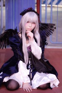 Rating: Safe Score: 0 Tags: 1girl black_legwear black_wings blurry blurry_background closed_mouth depth_of_field dress feathers frills indoors long_hair long_sleeves looking_at_viewer pantyhose silver_hair sitting solo suigintou wings User: admin