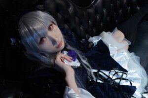 Rating: Safe Score: 0 Tags: 1girl doll_joints dress frills gothic_lolita lips lolita_fashion long_sleeves looking_at_viewer red_eyes solo suigintou User: admin