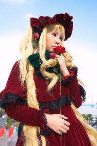 Rating: Safe Score: 0 Tags: 1girl bangs blonde_hair blue_eyes bonnet dress flower holding_flower lace long_hair long_sleeves looking_at_viewer red_capelet red_dress rose shinku solo very_long_hair User: admin