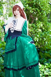 Rating: Safe Score: 0 Tags: 1girl blue_eyes blurry brown_hair depth_of_field dress green_dress green_eyes long_hair long_sleeves looking_at_viewer outdoors plant solo suiseiseki User: admin