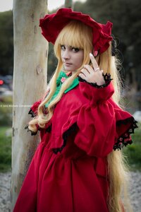 Rating: Safe Score: 0 Tags: 1girl blonde_hair blurry bonnet bow dress long_hair long_sleeves looking_at_viewer outdoors photo red_dress shinku solo User: admin