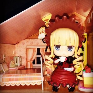 Rating: Safe Score: 0 Tags: 1girl blonde_hair blue_eyes bonnet cake chibi doll dress drill_hair food long_hair pastry shinku sitting solo table twin_drills User: admin