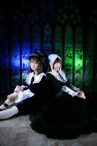 Rating: Safe Score: 0 Tags: 2girls black_dress brown_hair dress hat long_hair long_sleeves multiple_cosplay multiple_girls sitting tagme User: admin