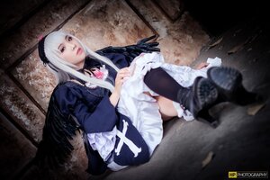 Rating: Safe Score: 0 Tags: 1girl black_wings boots dress feathers frills gothic_lolita hairband lips lolita_fashion long_hair long_sleeves red_eyes silver_hair sitting solo suigintou wings User: admin