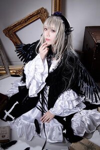 Rating: Safe Score: 0 Tags: 1girl black_dress dress feathers frills hat indoors lips long_hair long_sleeves looking_at_viewer realistic sitting solo suigintou User: admin