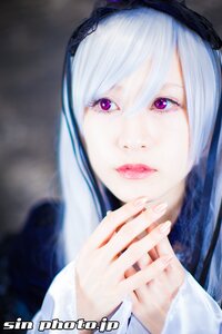 Rating: Safe Score: 0 Tags: 1girl bangs blurry blurry_background closed_mouth depth_of_field hairband hands_together lips looking_at_viewer purple_eyes silver_hair solo suigintou User: admin