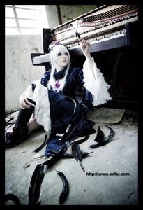 Rating: Safe Score: 0 Tags: 1girl auto_tagged bird feathers hair_ornament letterboxed long_hair sitting solo suigintou white_hair User: admin