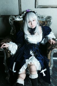 Rating: Safe Score: 0 Tags: 1girl black_dress black_legwear dress frills gothic_lolita lips lolita_fashion long_hair sitting solo suigintou thighhighs white_hair User: admin