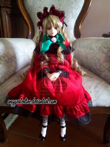 Rating: Safe Score: 0 Tags: 1girl blonde_hair blue_eyes bonnet bow chair couch doll dress flower long_hair long_sleeves looking_at_viewer rose shinku shoes sitting solo User: admin