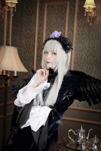 Rating: Safe Score: 0 Tags: 1girl bangs black_dress blurry closed_mouth feathers gothic_lolita hairband indoors lips lolita_fashion long_hair long_sleeves looking_at_viewer red_eyes sitting solo suigintou white_hair wings User: admin