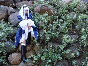 Rating: Safe Score: 0 Tags: 1girl blue_dress boots closed_eyes dress long_hair nature outdoors sitting solo suigintou white_hair User: admin
