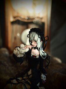 Rating: Safe Score: 0 Tags: 1girl black_dress choker doll dress frills gothic_lolita lolita_fashion lolita_hairband long_sleeves red_eyes solo suigintou wide_sleeves User: admin