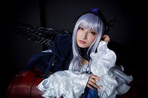 Rating: Safe Score: 0 Tags: 1girl bangs black_background dress frills lips long_hair long_sleeves looking_at_viewer silver_hair solo suigintou upper_body wings User: admin