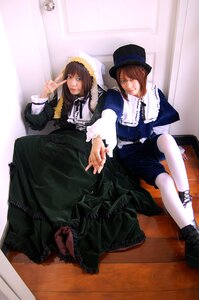 Rating: Safe Score: 0 Tags: 2girls blue_eyes boots brown_hair dress frills hat multiple_cosplay multiple_girls short_hair siblings sitting tagme top_hat twins v User: admin