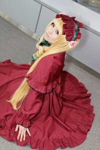 Rating: Safe Score: 0 Tags: 1girl blonde_hair blue_eyes bonnet capelet dress frills long_hair long_sleeves looking_at_viewer photo red_dress shinku sitting solo User: admin