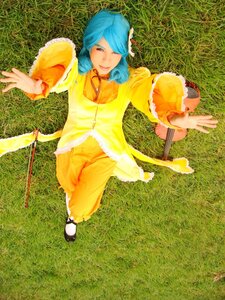 Rating: Safe Score: 0 Tags: blue_hair dress flower grass kanaria long_hair long_sleeves outstretched_arm outstretched_arms red_eyes shoes smile solo yellow_dress User: admin