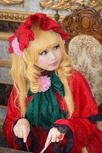 Rating: Safe Score: 0 Tags: 1girl bangs blonde_hair blue_eyes blurry blurry_background depth_of_field dress drill_hair flower lips long_hair makeup painting_(object) photo red_dress shinku solo upper_body User: admin