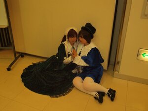 Rating: Safe Score: 0 Tags: 2girls black_hair brown_hair closed_eyes dress hat indoors jewelry multiple_cosplay multiple_girls sitting tagme yuri User: admin