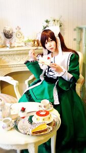 Rating: Safe Score: 0 Tags: 1girl brown_hair dress food green_dress long_hair solo suiseiseki User: admin