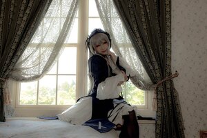Rating: Safe Score: 0 Tags: 1girl curtains indoors long_hair long_sleeves looking_at_viewer red_eyes silver_hair sitting solo suigintou window User: admin