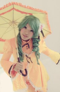 Rating: Safe Score: 0 Tags: 1girl dress drill_hair flower frills green_hair holding_umbrella kanaria parasol smile solo umbrella User: admin