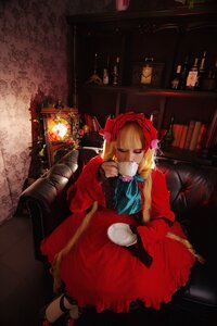 Rating: Safe Score: 0 Tags: 1girl blonde_hair book chair closed_eyes cup dress holding_cup long_hair mug shinku sitting solo teacup User: admin