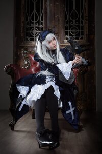 Rating: Safe Score: 0 Tags: 1girl black_footwear black_legwear blue_eyes dress frills long_hair looking_at_viewer shoes sitting solo suigintou User: admin