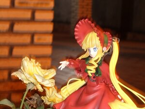 Rating: Safe Score: 0 Tags: 1girl bangs blonde_hair blue_eyes blurry bonnet bow doll dress drill_hair long_hair long_sleeves red_dress shinku solo twintails very_long_hair User: admin