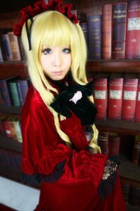 Rating: Safe Score: 0 Tags: 1girl animal bangs black_cat blonde_hair blue_eyes blurry blurry_background bonnet book bookshelf capelet cat depth_of_field dress indoors library long_hair looking_at_viewer red_dress shinku solo User: admin
